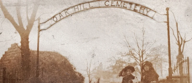 Sepia-tinted Oak Hill Cemetery sign from 1910s